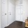 Apartment entryway with a bench and pillows
