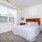 Styled bedroom with brown carpet