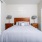 Styled bedroom with views of en-suite bathroom