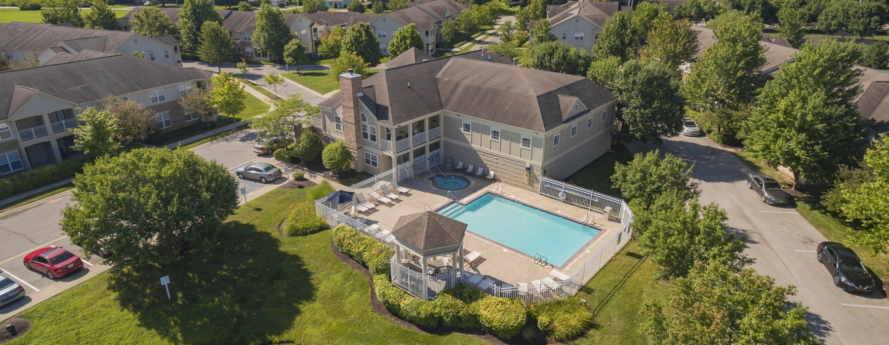 Apartment building exterior aerial photo with pool
